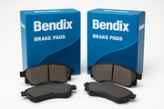 2 boxes of Bendix brake pads with the contents of the boxes displayed in front of the boxes with branding showing prominently